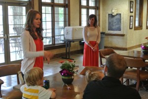 Jenny Montange (left) shares her story with family and friends at the 2013 Scholarship Dinner